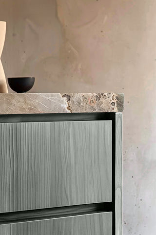 Close-up of Platinum Pine premium wood stain on a fluted bathroom vanity