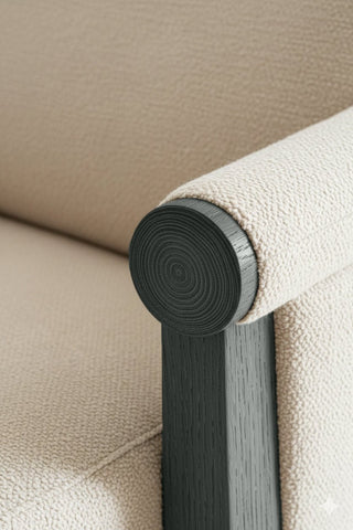 Close-up of Pebbled Grey premium wood stain on a wooden chair frame